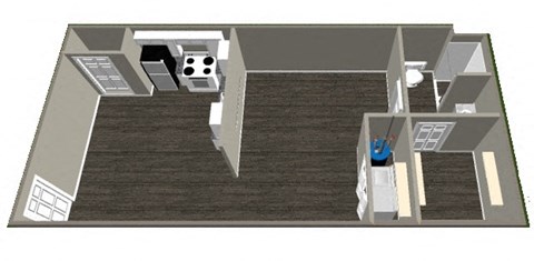 A person is standing in a room with a bed, a desk, and a chair.